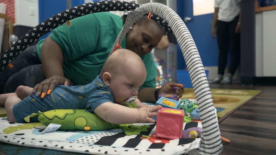 infant on play mat