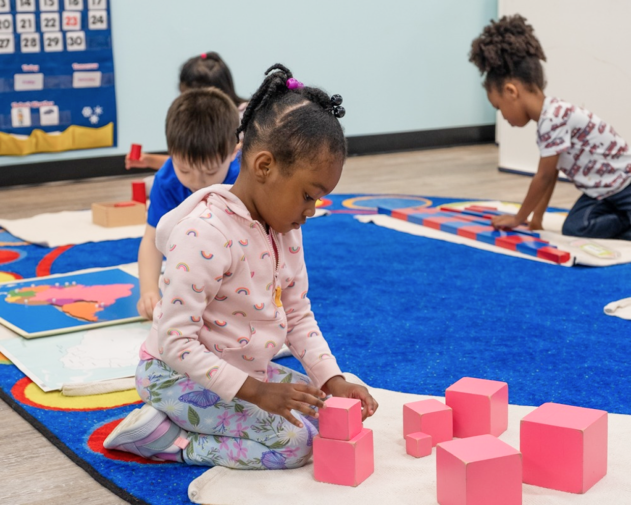 child stacking blocks